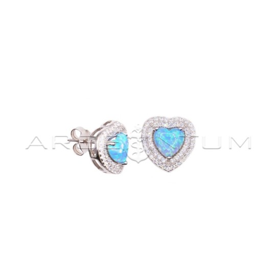 Lobe earrings with opalescent light blue heart stone in a pave frame of white gold plated white zircons in 925 silver