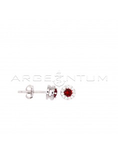 Stud earrings with central...