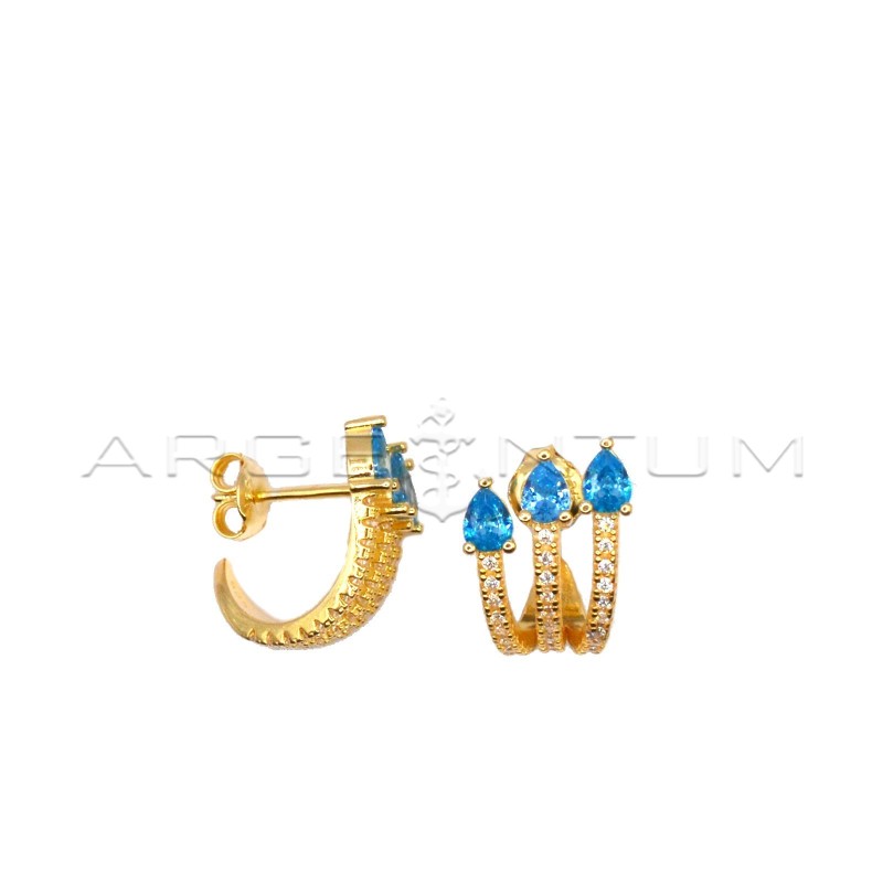 Simicircle stud earrings with three white zirconia strands with blue zircon drops and yellow gold plated snap attachment in 925 