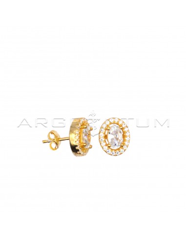 Stud earrings with central oval white...