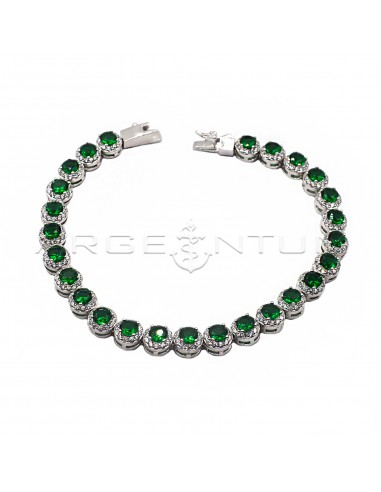 Bracelet of round green zircons in a...