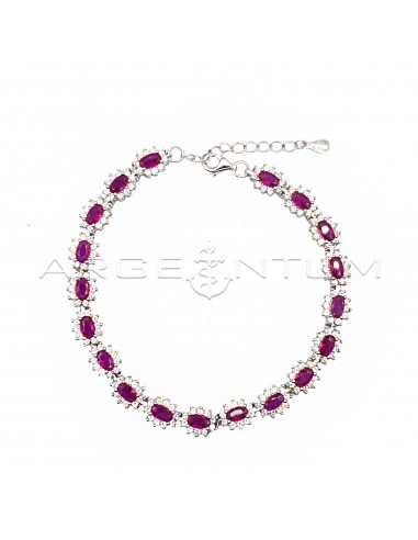 Bracelet with red oval zircons in a...