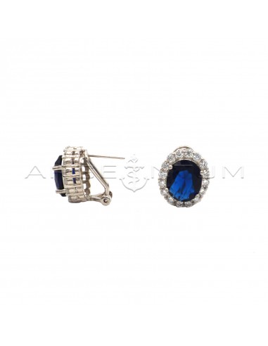 Stud earrings with blue oval stone in...
