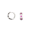 Hoop earring with snap closure and round red zircons in a frame of white zircons white gold plated in 925 silver
