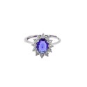Anello regolabile con pietra ovale blu in cornice di zirconi bianchi a griffe placcato oro bianco in argento 925